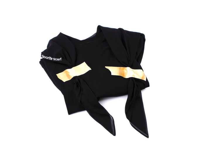 Black t-shirt with a taped black scarf