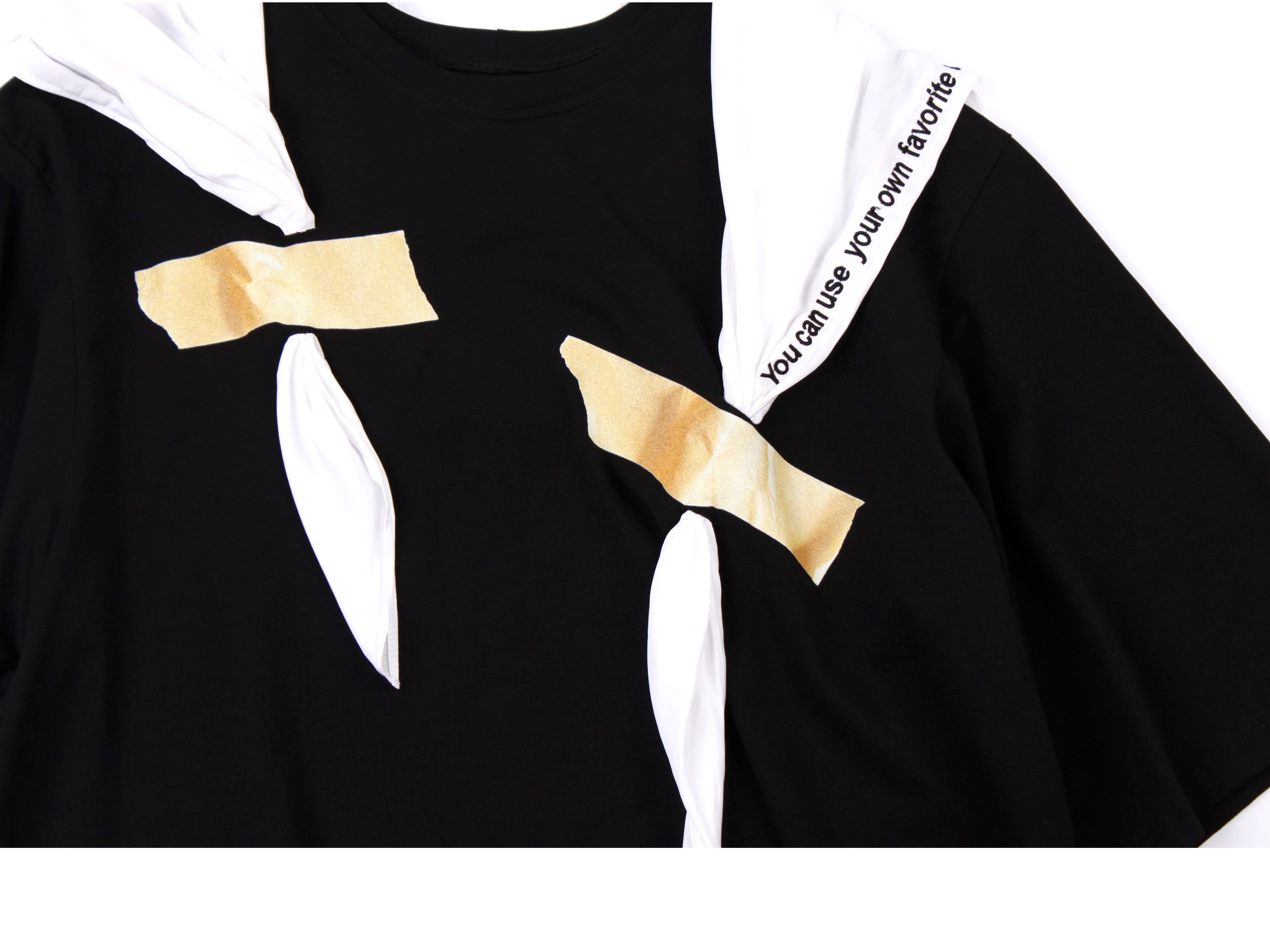 Black t-shirt with a taped white scarf